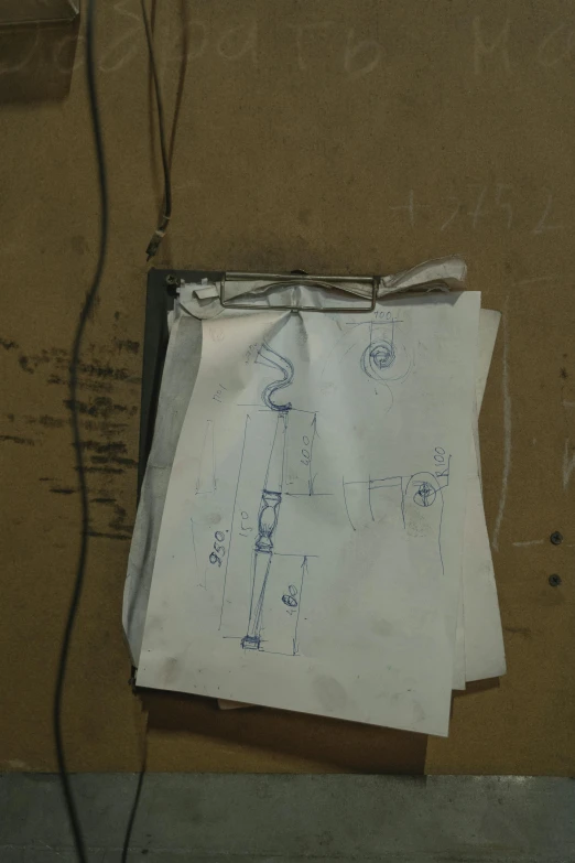 a piece of paper sitting on top of a wall, a drawing, mechanic, set design, leaked image