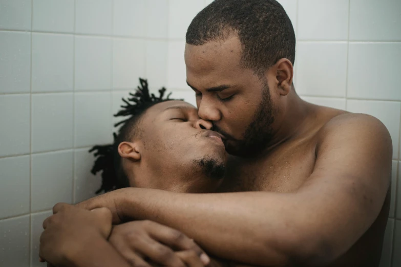 a man and a woman hugging in a bathroom, by Matija Jama, trending on pexels, lgbt, african american, ( ultra realistic, kissing