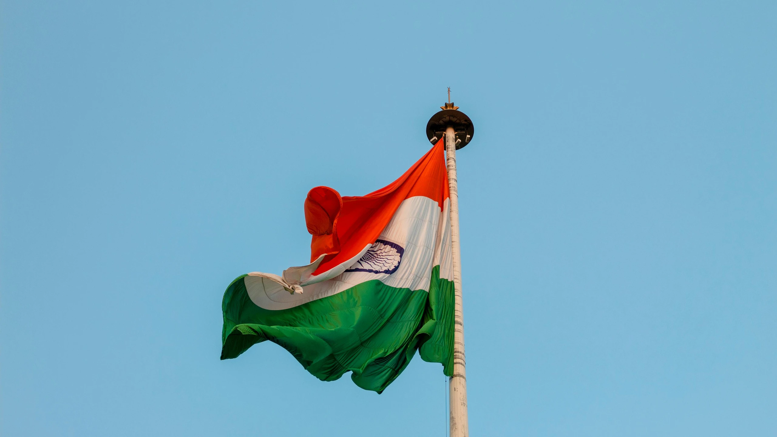 the indian flag is flying high in the sky, an album cover, by Julia Pishtar, pexels, 15081959 21121991 01012000 4k, preserved historical, celebration, a tall