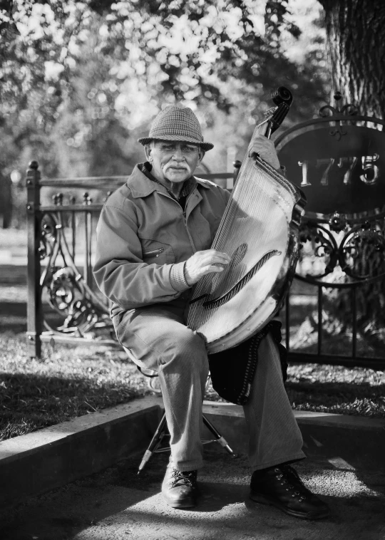 a man sitting on a bench playing a musical instrument, double bass, portrait photo of an old man, 15081959 21121991 01012000 4k, historical photo