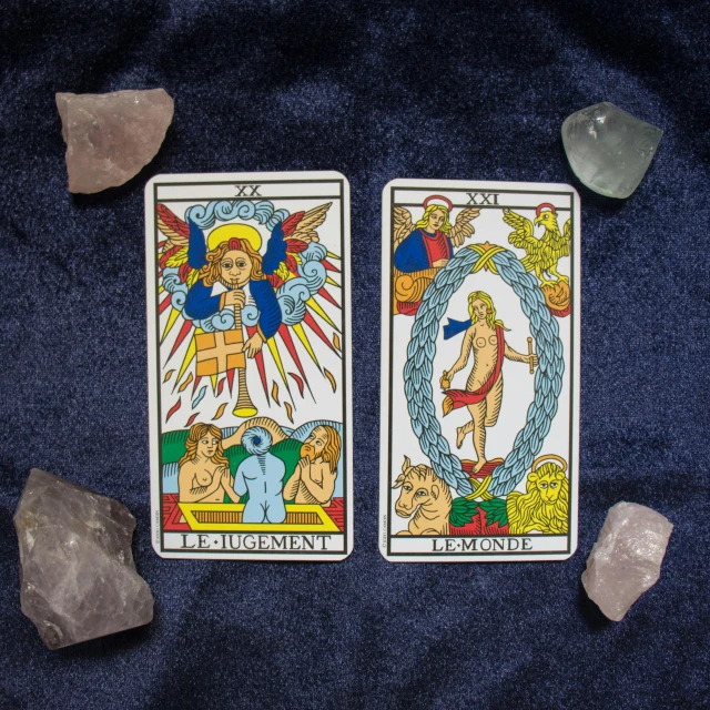 a couple of cards sitting on top of a table, renaissance, symmetrical tarot card, crystal incrustations, top-down shot, sapphire