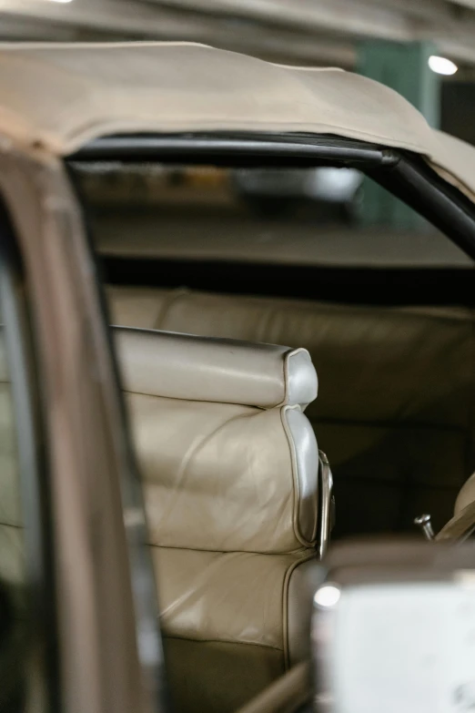 a dog sitting in the driver's seat of a car, by David Simpson, visual art, white soft leather model, close-up shot from behind, fully covered in drapes, inspect in inventory image