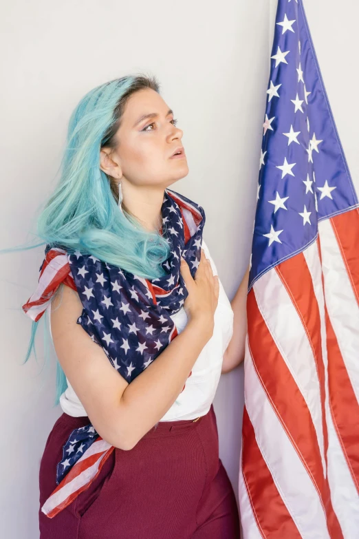 a woman with blue hair standing next to an american flag, aurora aksnes, asher duran, teal, angelawhite