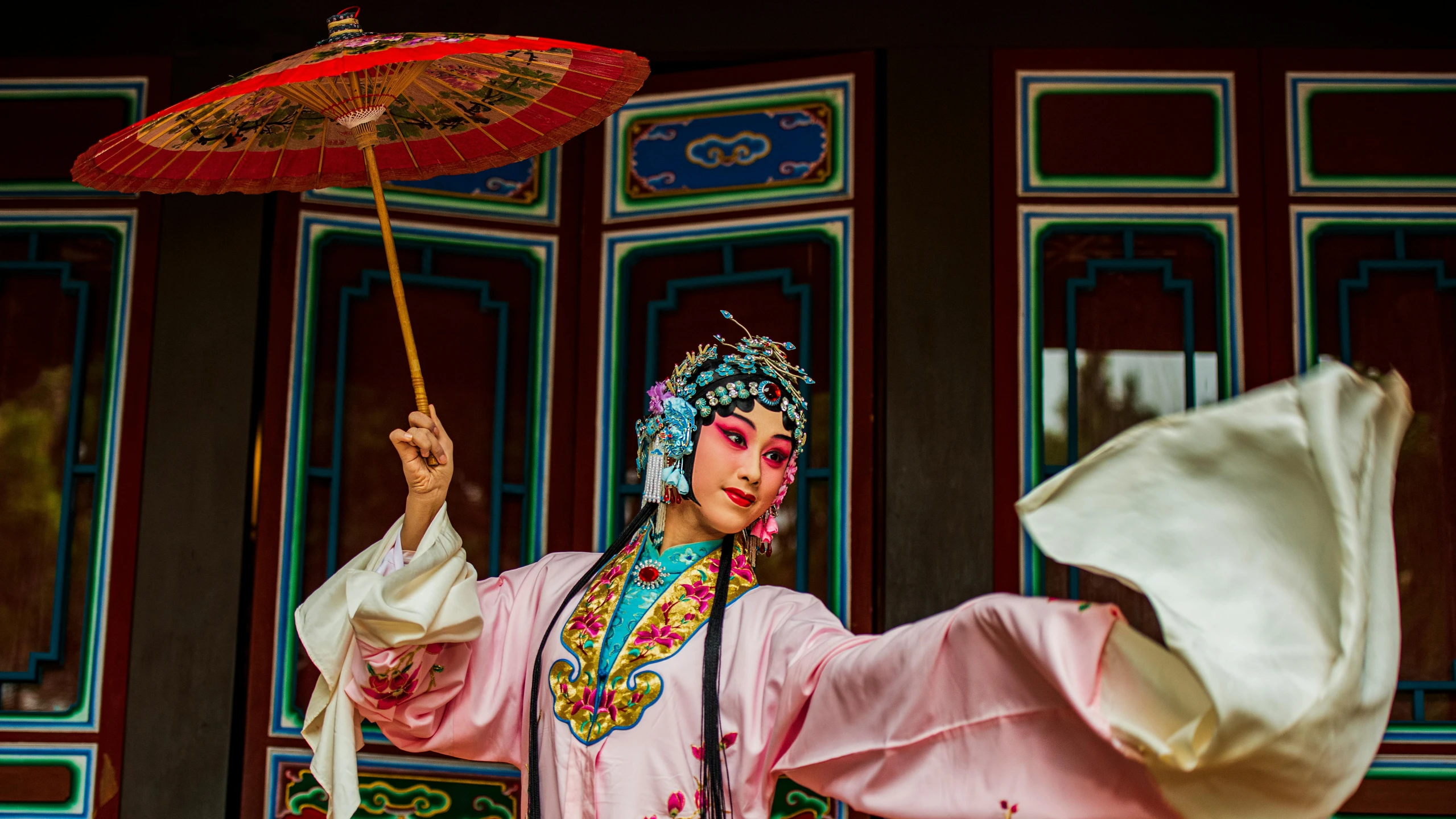 a woman in a pink dress holding a red umbrella, inspired by Qian Du, pexels contest winner, arabesque, peking opera, performing, avatar image, square