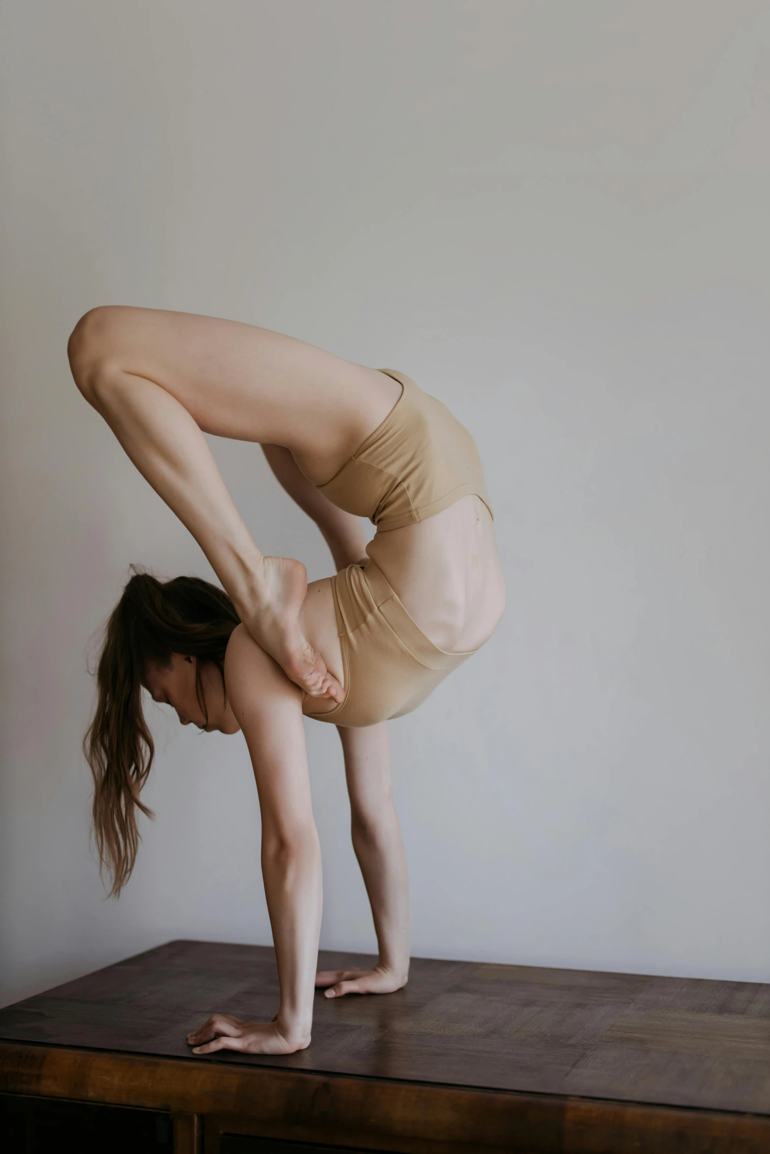 a woman in a leo leo leo leo leo leo leo leo leo leo leo leo leo leo, by Emily Shanks, unsplash, arabesque, bent over posture, wavy hair spread out, sydney hanson, studio photo