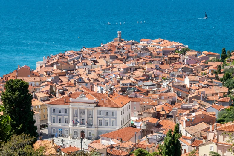 a large white building sitting on top of a hill next to the ocean, pexels contest winner, renaissance, tiled roofs, tiepolo, brown, square