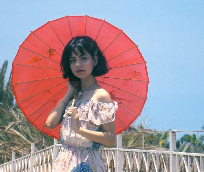 a woman in a dress holding a red umbrella, an album cover, inspired by Yuko Tatsushima, pexels, kiko mizuhara, melanie martinez, anime thai girl, still from a movie