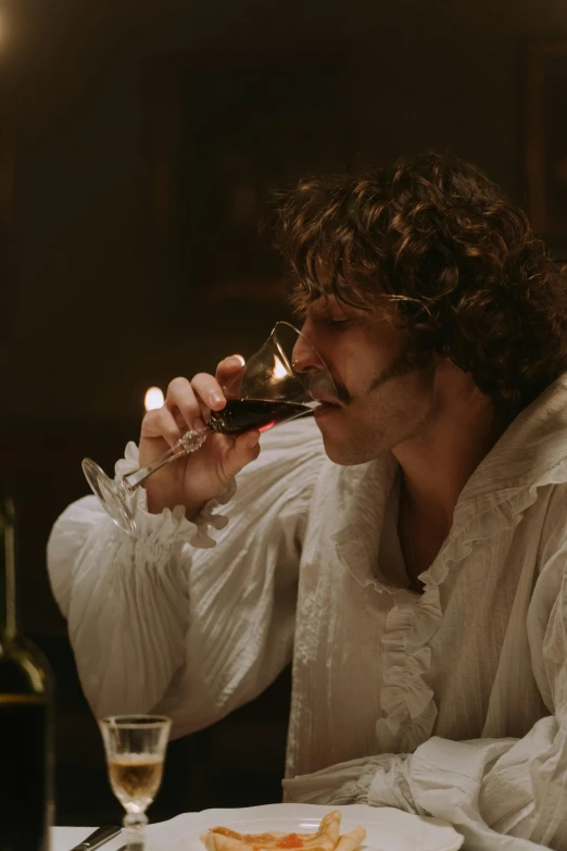 a man sitting at a table with a glass of wine, inspired by Karl Bryullov, pexels, renaissance, film still from the movie, baroque curls, romantic lead, [ theatrical ]