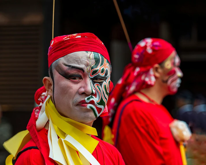 a group of men standing next to each other, a photo, inspired by Xie Huan, pexels contest winner, warrior face painting red, square, looking to his left, chi-gong