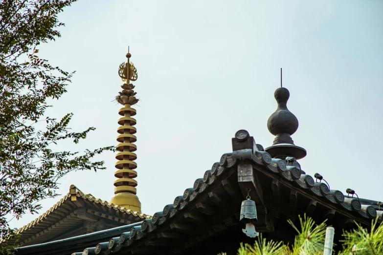 a close up of a building with a tower in the background, inspired by Itō Jakuchū, unsplash, shin hanga, guanyin, domes, lead - covered spire, high details photo