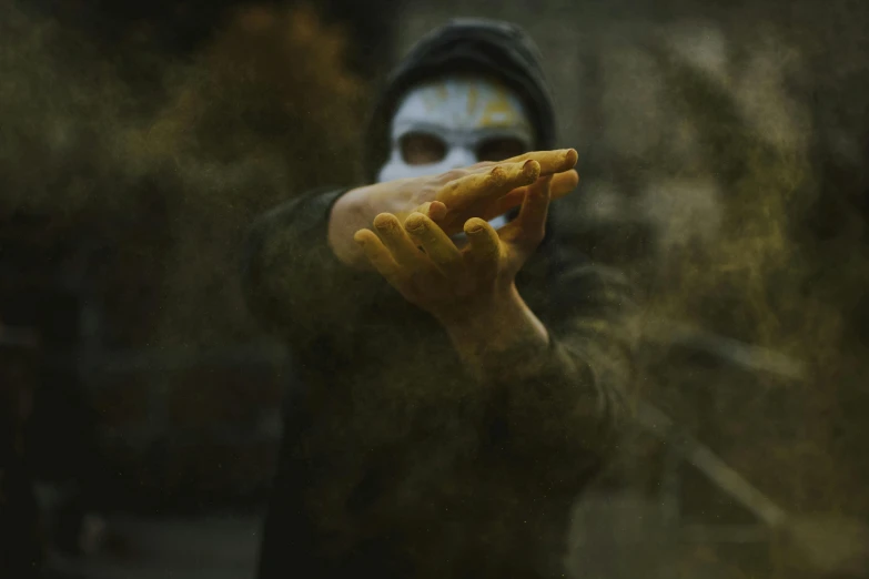 a person holding a slice of pizza in their hand, by Adam Marczyński, pexels contest winner, graffiti, ghost mask, in a fighting pose, haze, gold and black metal
