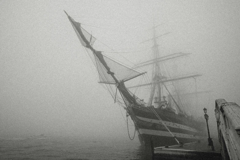 a black and white photo of a boat in the fog, by Jens Jørgen Thorsen, romanticism, an impossibly huge pirate ship, fog. by greg rutkowski, low detail, anna nikonova