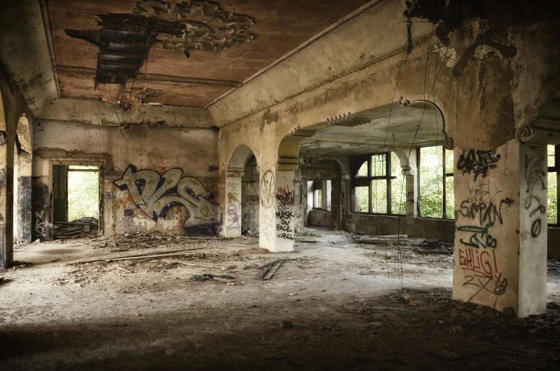 an abandoned building with lots of graffiti on the walls, by Kristian Zahrtmann, pexels contest winner, destroyed nature, fallen columns, in the middle of an empty room, promo image