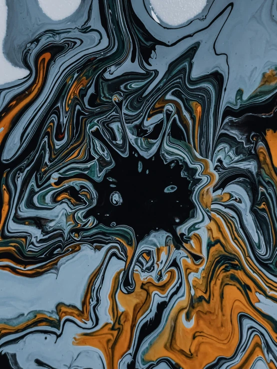 a close up of a piece of art on a table, trending on pexels, abstract art, dark grey and orange colours, made of liquid, psychedelic visuals, swirls