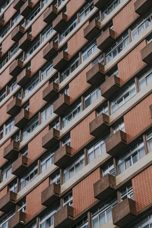 a tall brick building with many windows and balconies, unsplash, brutalism, brown, 15081959 21121991 01012000 4k