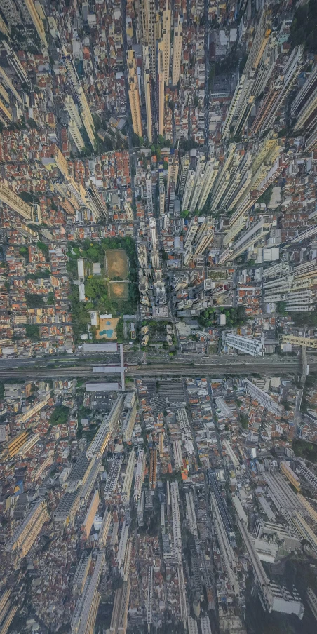 an aerial view of a city with lots of tall buildings, an album cover, by Joze Ciuha, pexels contest winner, photorealism, sao paulo in the year 2 0 7 0, google maps street view, houses and roads, malika favre