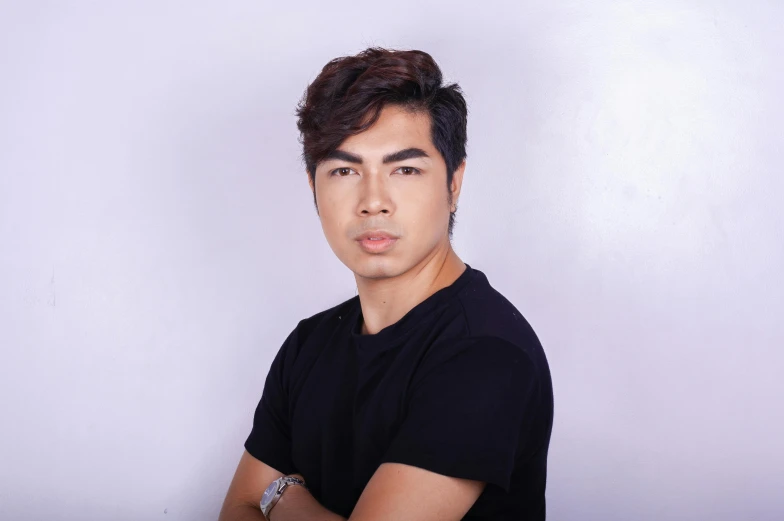 a man in a black shirt posing for a picture, cindy avelino, close - up studio photo, avatar image, classified photo