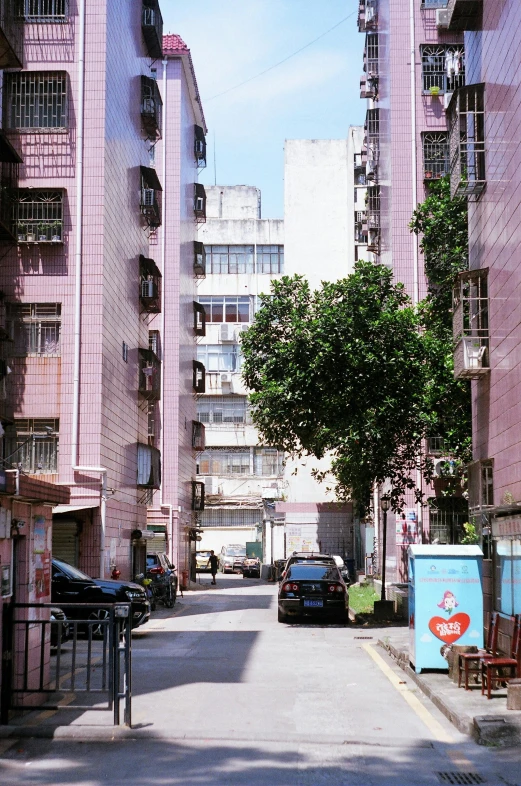 a city street filled with lots of tall buildings, pink concrete, in 2 0 0 2, residential area, lulu chen