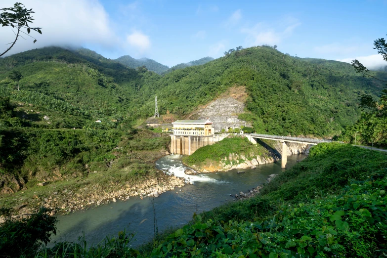 a river running through a lush green hillside, a portrait, infrastructure, quy ho, profile image, landslides