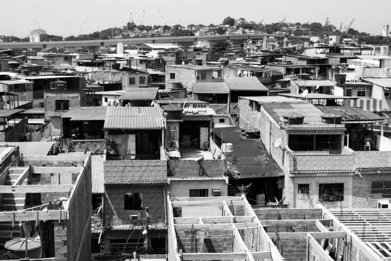 a black and white photo of a city, by Felipe Seade, makeshift houses, dezeen, salvador, brown