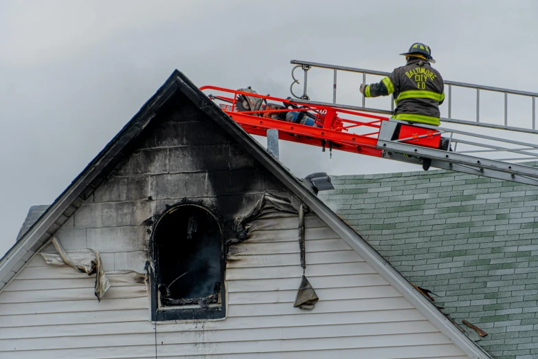 a fireman standing on a ladder on top of a house, a photo, by Joe Stefanelli, pexels contest winner, avatar image, aftermath, fire stainglass, 15081959 21121991 01012000 4k