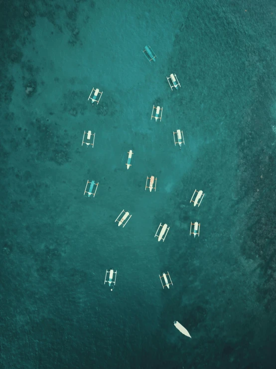 a group of boats floating on top of a body of water, by Robbie Trevino, pexels contest winner, minimalism, satelite imagery, screensaver, multiple stories, manila