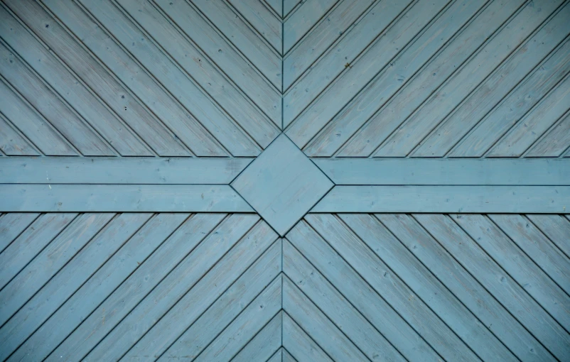a blue door with a cross pattern on it, an album cover, inspired by Agnes Martin, pexels contest winner, geometric abstract art, diamond, wood planks, light-blue, detailed photo 8 k