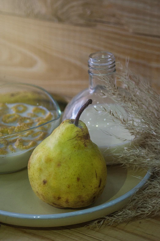 a bowl of yogurt and a pear on a plate, inspired by Anna Ancher, unsplash, renaissance, background image, resin, grain”, with a soft