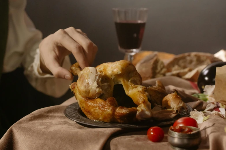 a close up of a plate of food on a table, inspired by Eugène Delacroix, pexels contest winner, photorealism, anthropomorphized chicken, with bread in the slots, cinematic pose, rituals