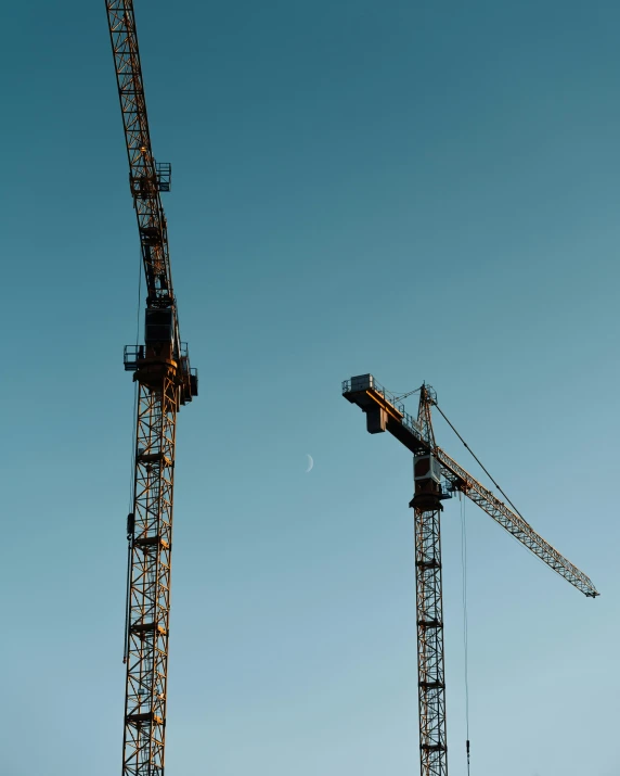 a couple of cranes that are next to each other, pexels contest winner, constructivism, profile image, tall thin, super high resolution, thumbnail
