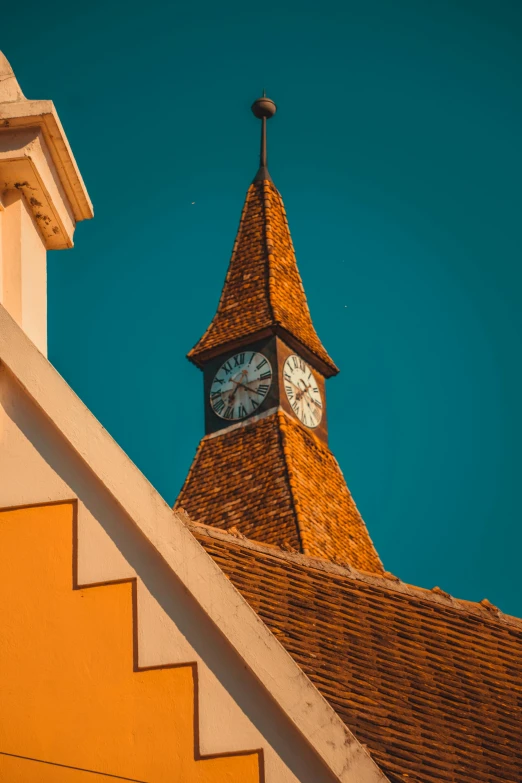 a clock that is on the side of a building, peaked wooden roofs, orange and blue sky, spire, village square