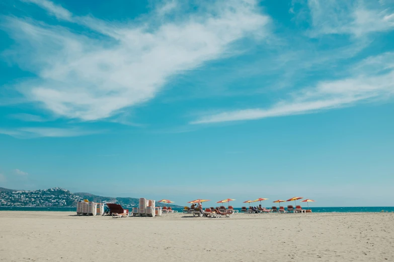 a group of umbrellas sitting on top of a sandy beach, by Carlo Martini, unsplash contest winner, clear blue skies, bay area, naples, thumbnail