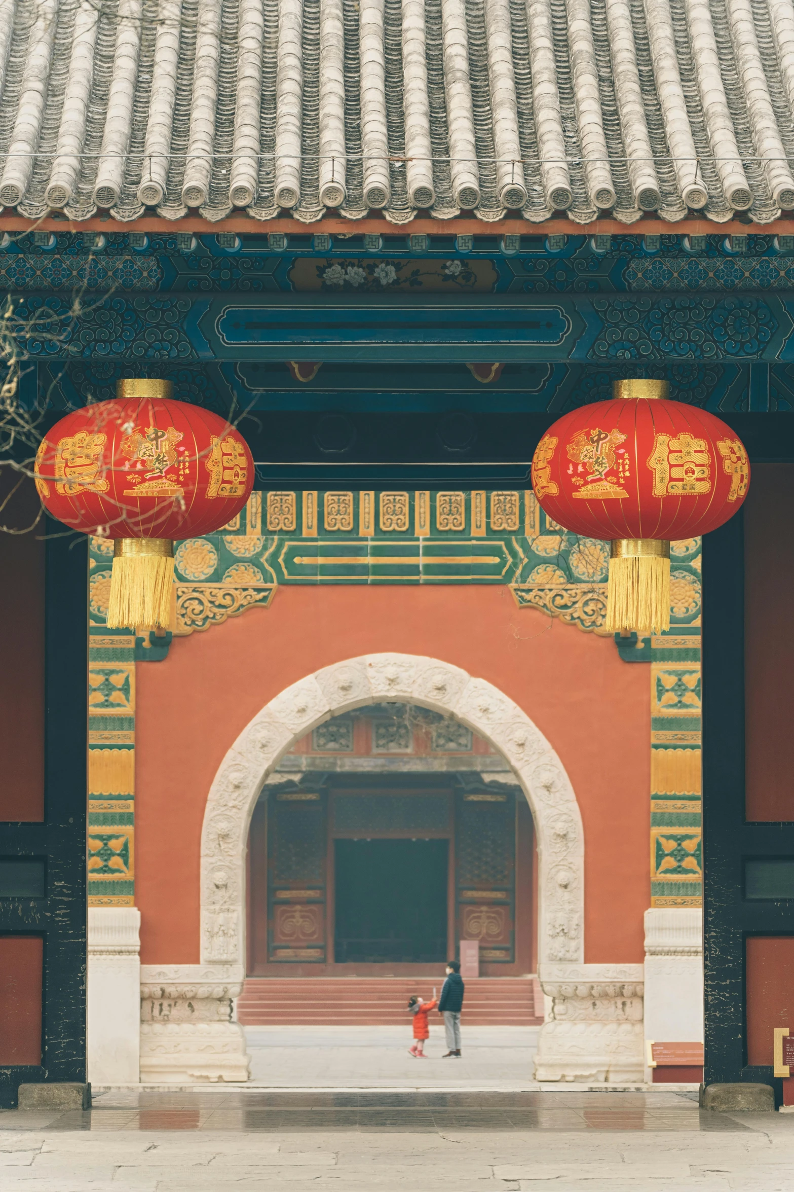 a couple of red lanterns hanging from the side of a building, a picture, inspired by Li Di, giant majestic archways, brown, dynasty, u