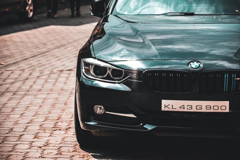 a black bmw parked on the side of the road, pexels contest winner, renaissance, closeup 4k, an elegant green, thumbnail, full dynamic colour