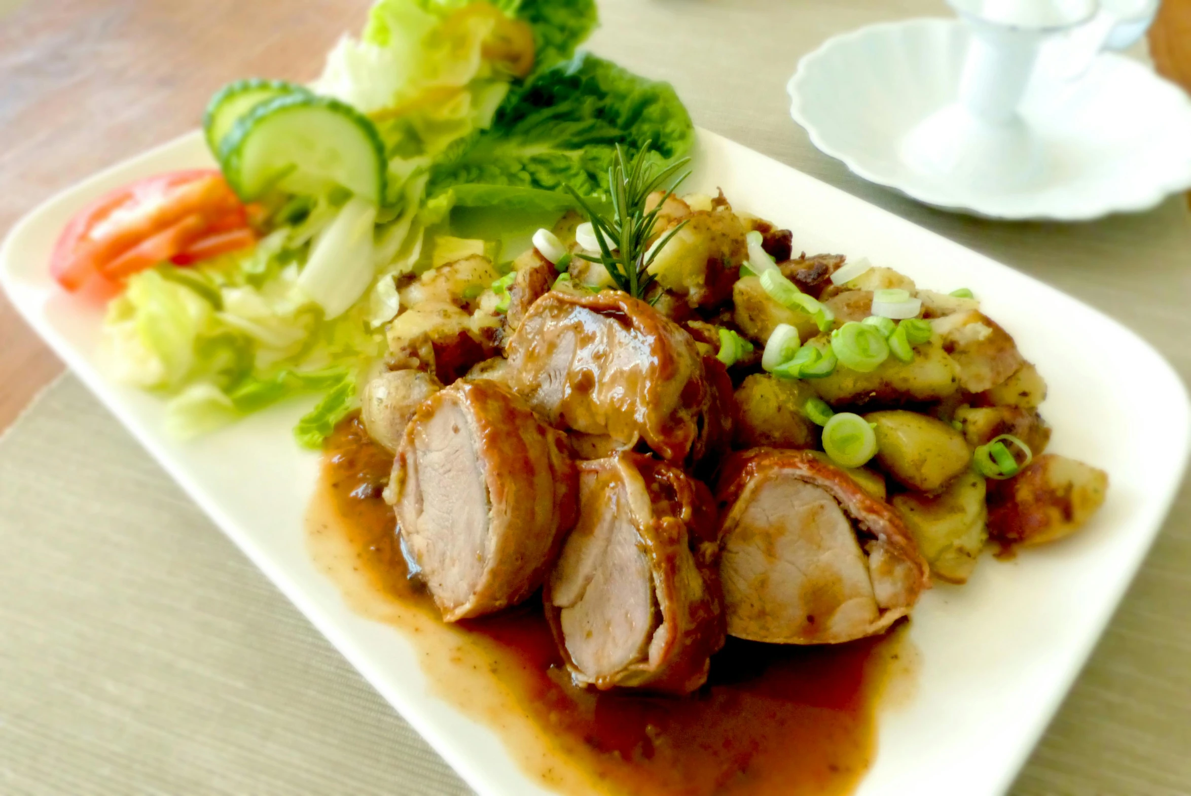 a close up of a plate of food on a table, patiphan sottiwilaiphong, realistic »