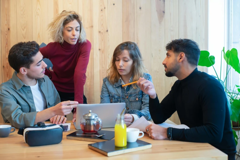 a group of people sitting around a wooden table, trending on pexels, studious, te pae, integrating with technology, concerned expression