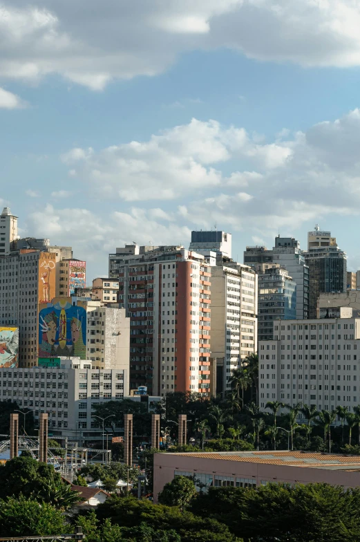 a view of a city from the top of a hill, by Felipe Seade, graffiti, avenida paulista, art deco buildings, ultrawide image