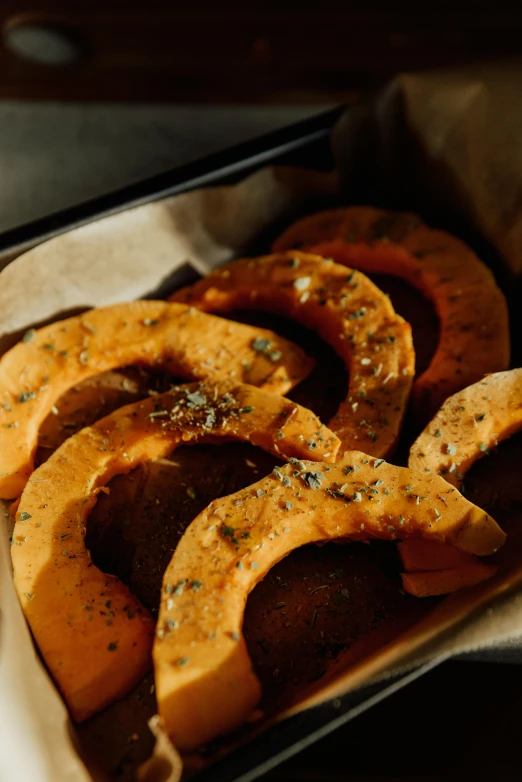 a tray that has some kind of food in it, a digital rendering, unsplash, pumpkin, brown holes, woodfired, upper body close up