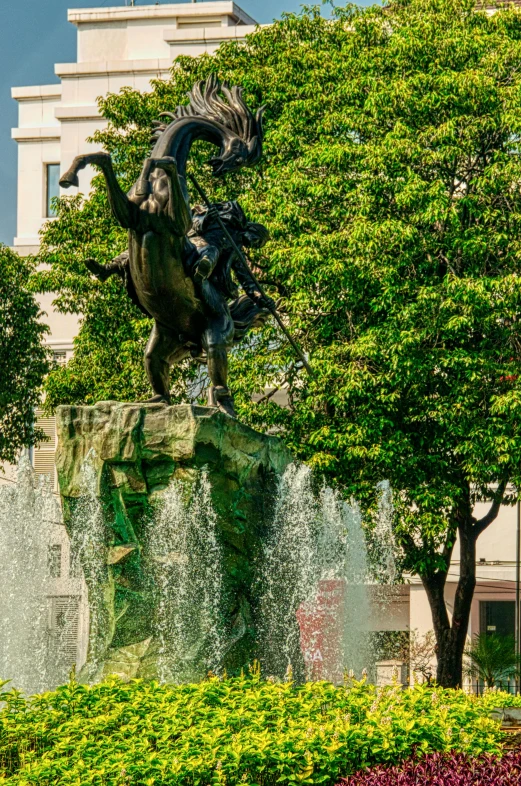 a statue of a man riding a horse next to a fountain, by Cherryl Fountain, on a bright day, kreuzberg, medium-shot, square