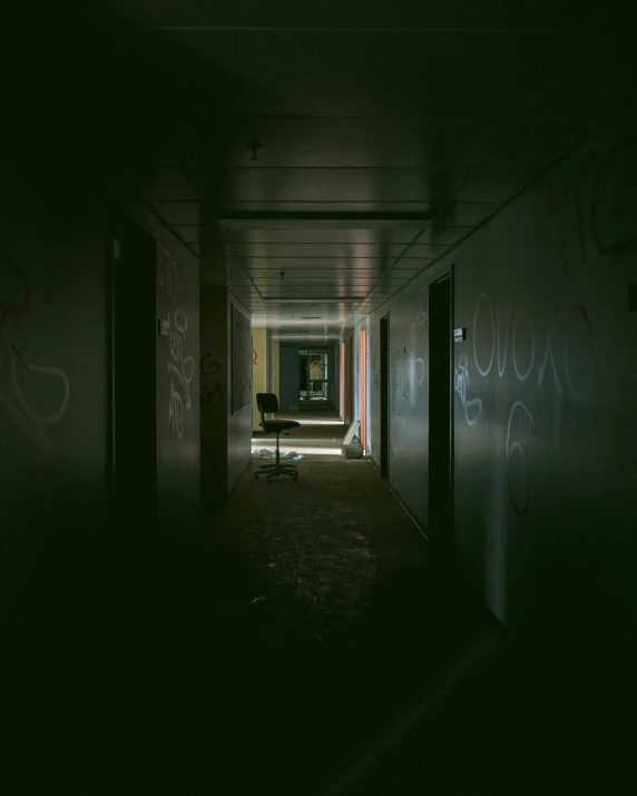 a dark hallway with graffiti on the walls, inspired by Elsa Bleda, unsplash contest winner, hospital interior, unsettling image, buildings covered in black tar, photo of scp-173