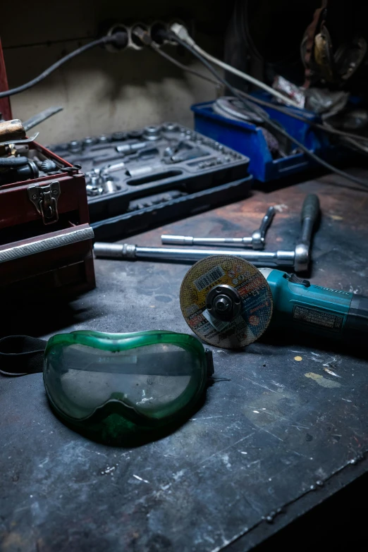 a pair of goggles sitting on top of a table, arbeitsrat für kunst, screwdrivers, inside iron and machines, thumbnail, crescent wrench