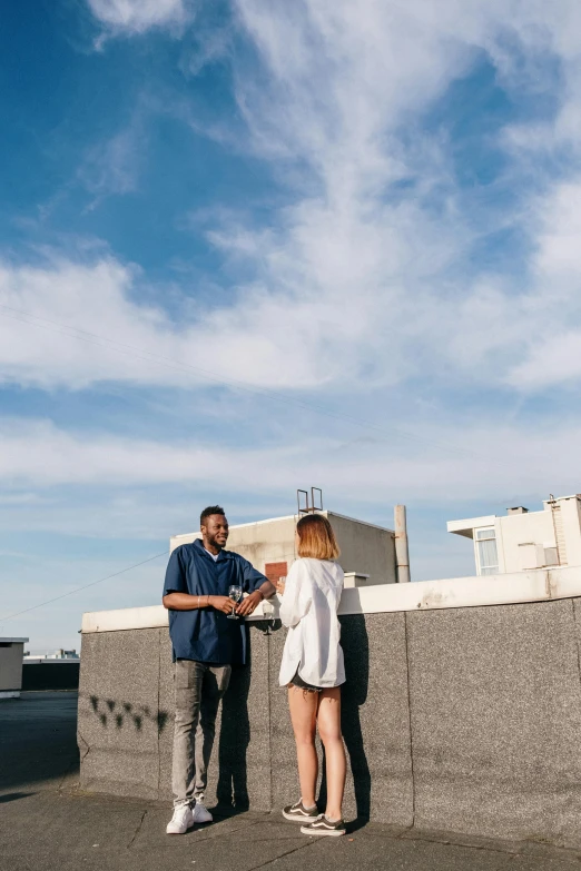 a man and a woman standing next to each other, by Lee Loughridge, pexels contest winner, renaissance, on rooftop, inspect in inventory image, blue sky, instagram story