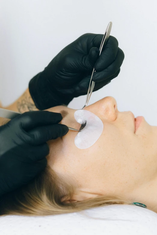 a woman getting her eyebrows done at a beauty salon, a tattoo, inspired by Hedi Xandt, trending on pexels, translucent gills, white lashes, thumbnail, on white