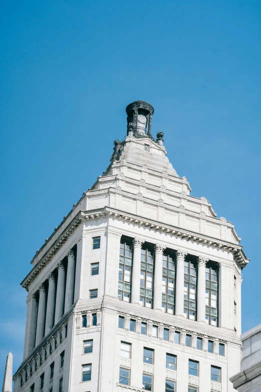 a tall building with a clock on top of it, rhode island, stalinist architecture, wide angle exterior 2022, artsationhq