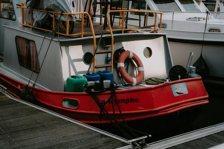 a red and white boat docked at a dock, by Raphaël Collin, pexels contest winner, happening, grey, seraphine, fully functional, thumbnail