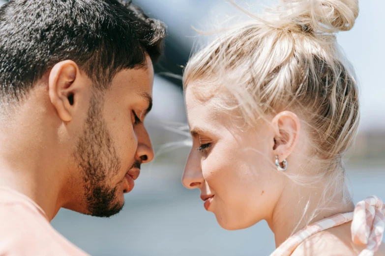 a man and a woman looking at each other, trending on pexels, sweaty face, mix of ethnicities and genders, blonde man, profile image