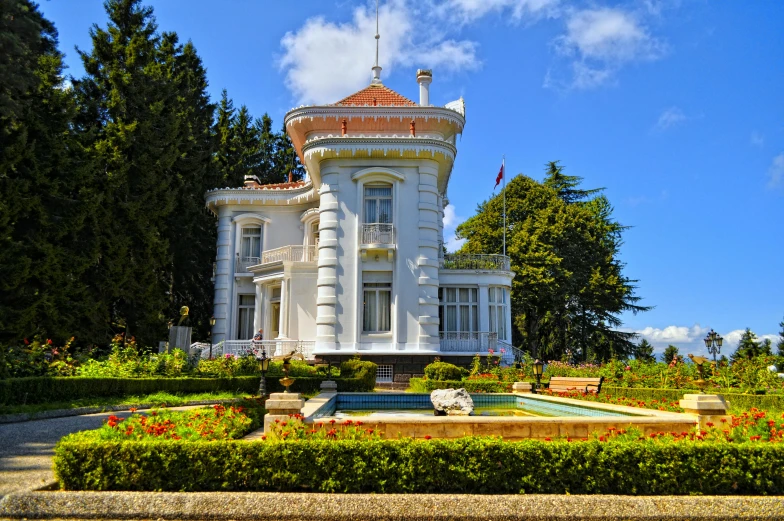 a large white building with a fountain in front of it, inspired by Serafino De Tivoli, pexels contest winner, art nouveau, chile, villa, myllypuro water tower, in red gardens