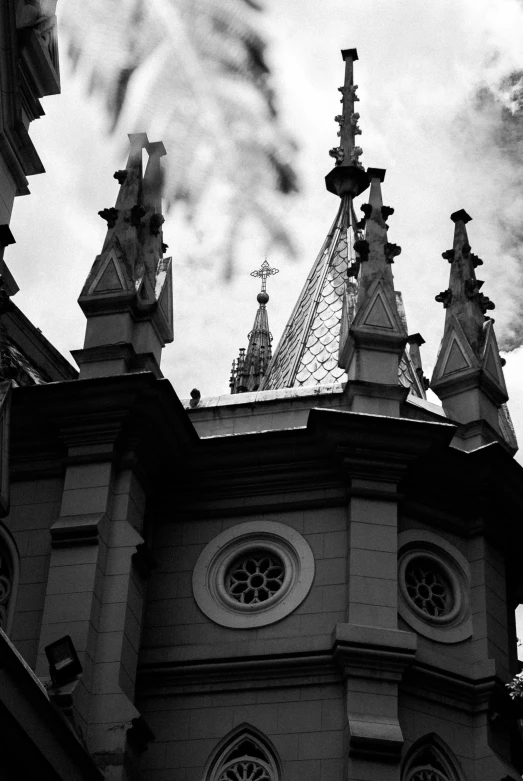 a black and white photo of a clock tower, a black and white photo, by Altichiero, baroque, favela spaceship cathedral, symmetrical crown, two towers, f 2. 8 3 5 mm