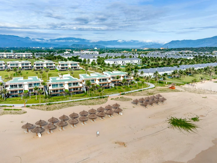 an aerial view of a beach resort with thatched umbrellas, in style of lam manh, profile image, apartment, camilo gc