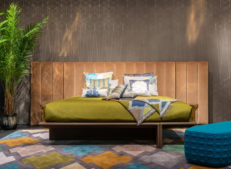 a bed sitting in a bedroom next to a potted plant, inspired by Alberto Morrocco, maximalism, dezeen showroom, fibanci background, chartreuse and orange and cyan, copper details